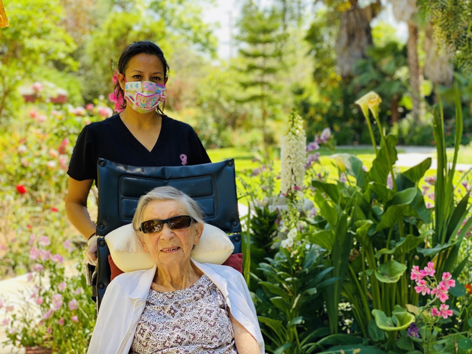 Resident and caregiver spending time outdoors