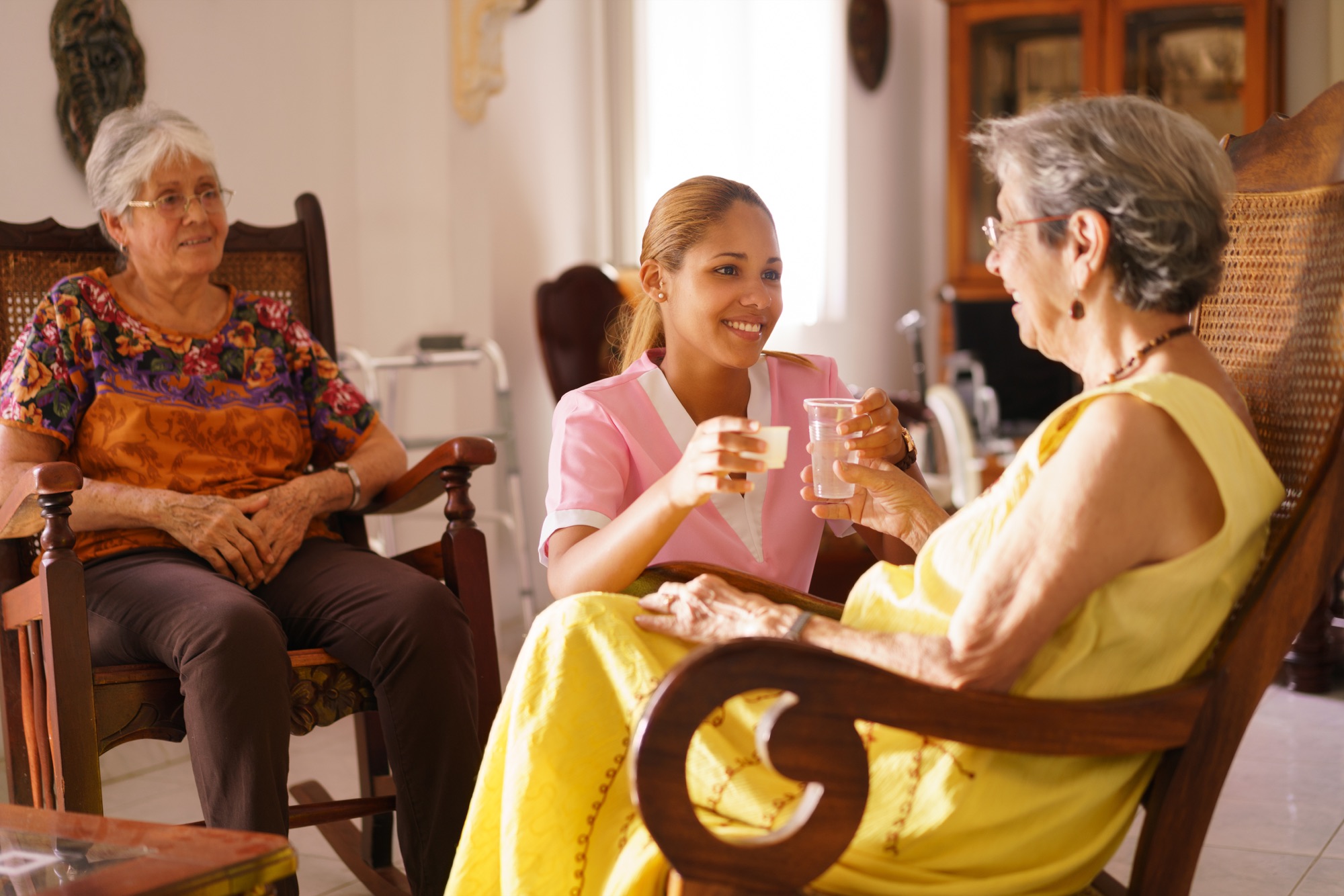 Residents and caregiver sharing a conversation