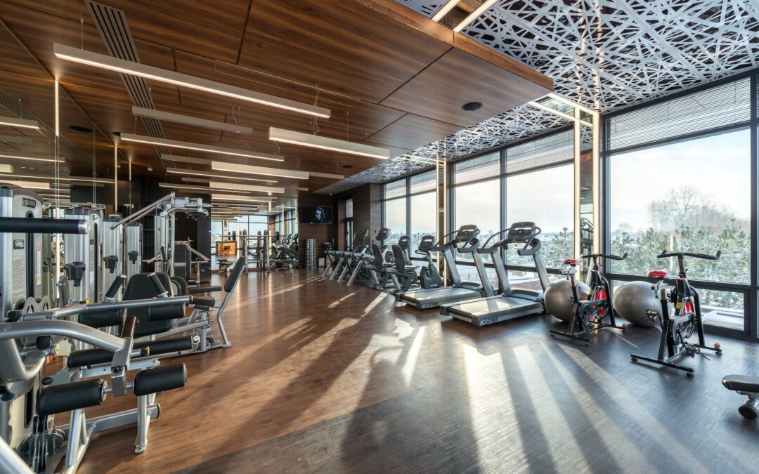 interior of modern fitness club with various machines and equipment